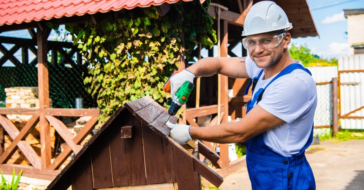 A man constructs a roof with his own hands.