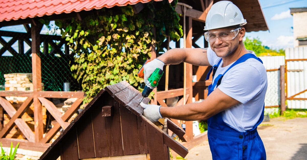 A man constructs a roof with his own hands.