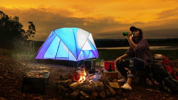 What are the benefits of living in a tent to save money?