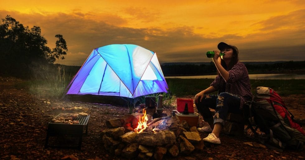 What are the benefits of living in a tent to save money?