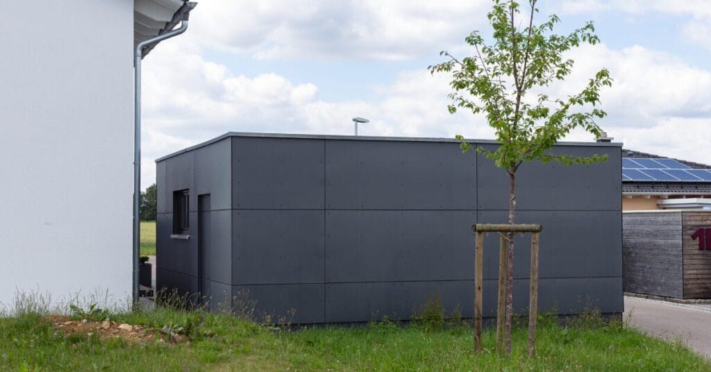 Metal Sheds: Your Clutter-Free Sanctuary Sleek new metal shed garage in suburban neighborhood