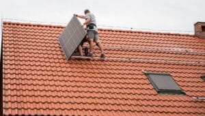 A solar power system is being installed off the grid on the roof.