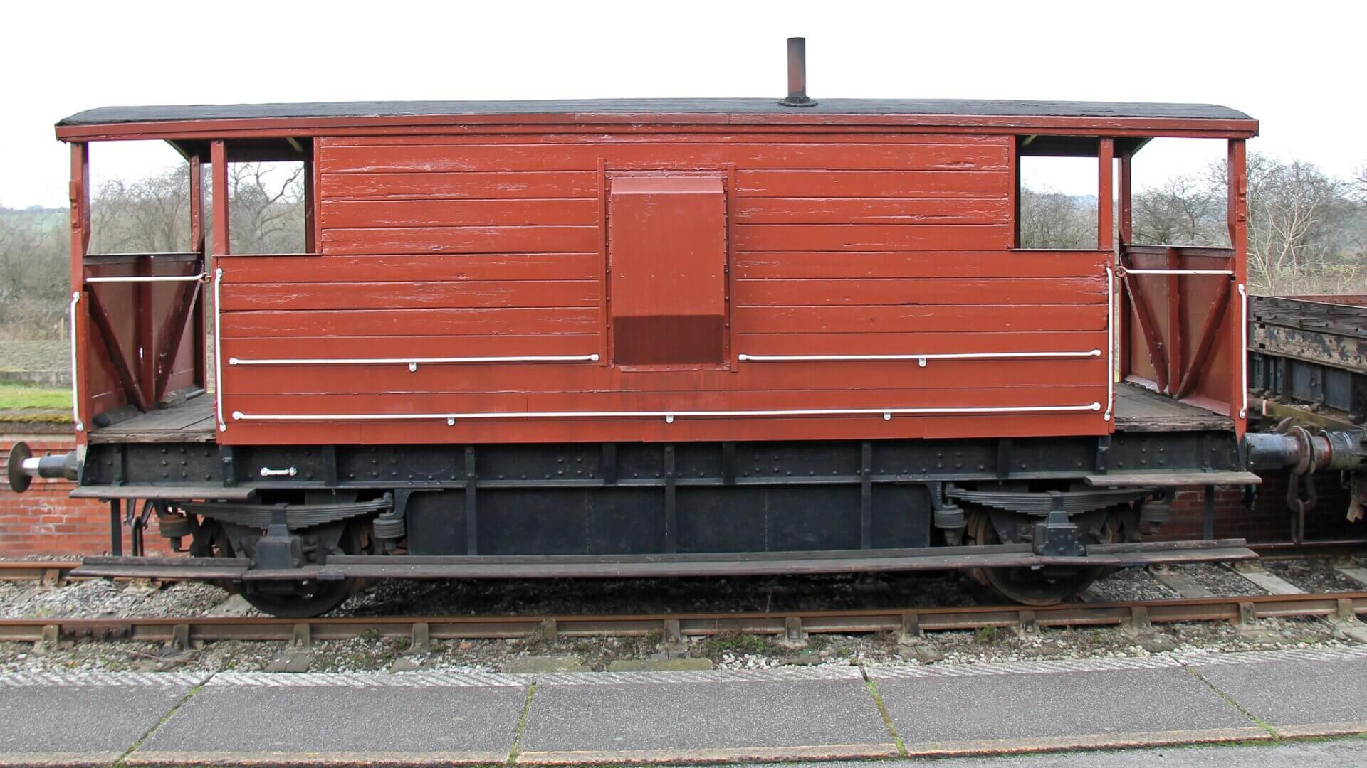 The iconic guard's van of a traditional British freight train.