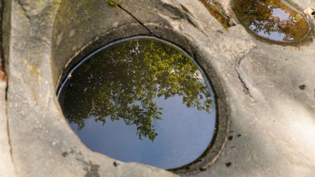 Designs for bird baths made of rocks.