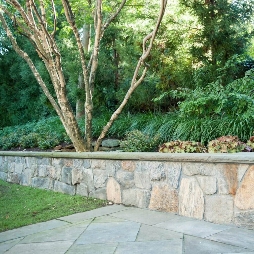 Discover the transformative power of installing a striking and durable retaining wall.