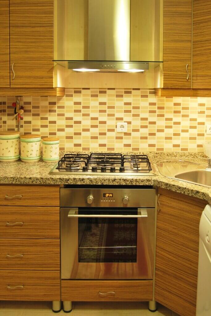 Install a range hood with a stylish design in kitchen remodel ideas
