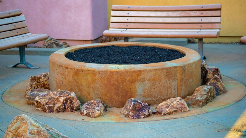I want to have a circular fire pit surrounded by rocks.