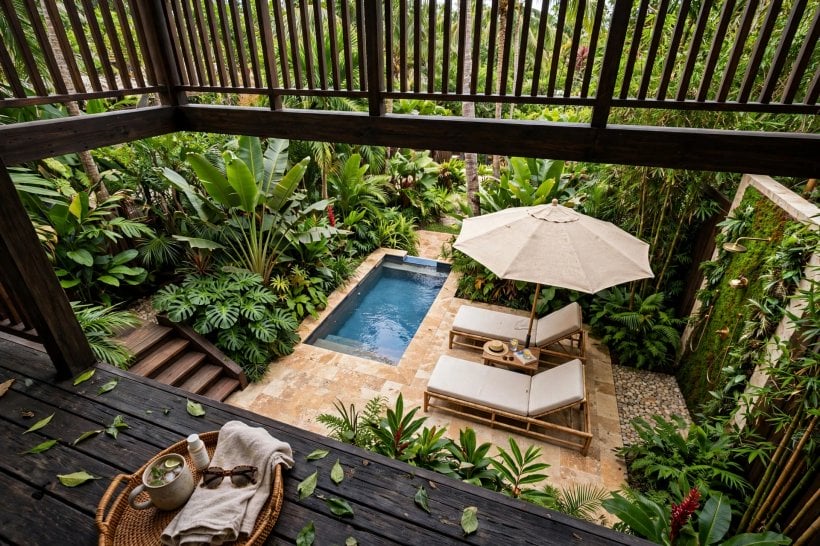 deck and patio combo: repeated planting in deck pots and patio beds tying the levels together