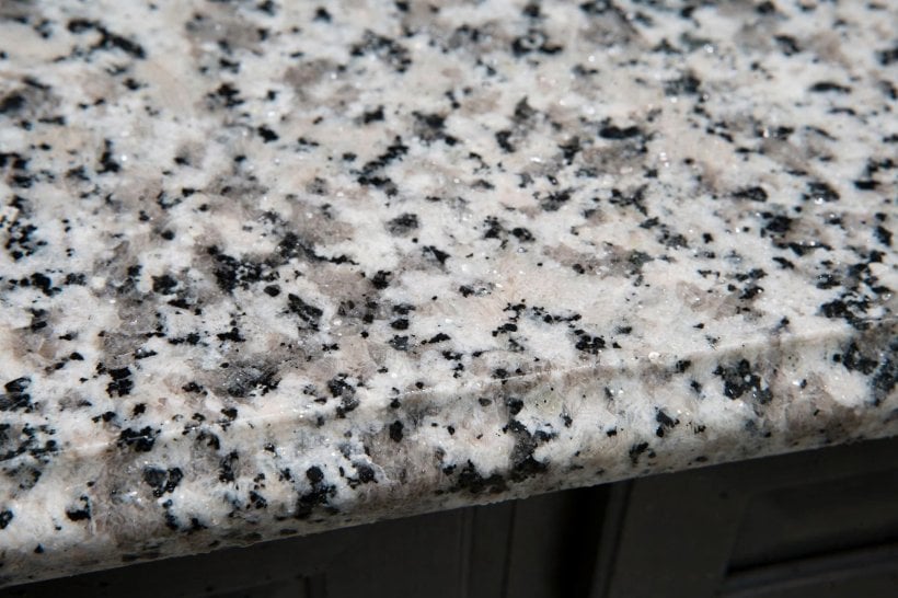 luna pearl granite: a pale grey speckled worktop surface seen up close