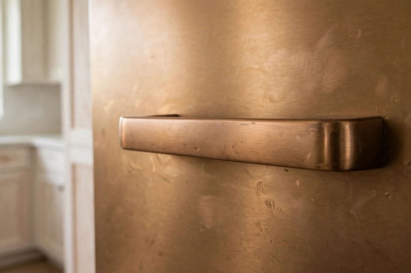 whirlpool sunset bronze appliances: a single statement range anchoring a neutral kitchen