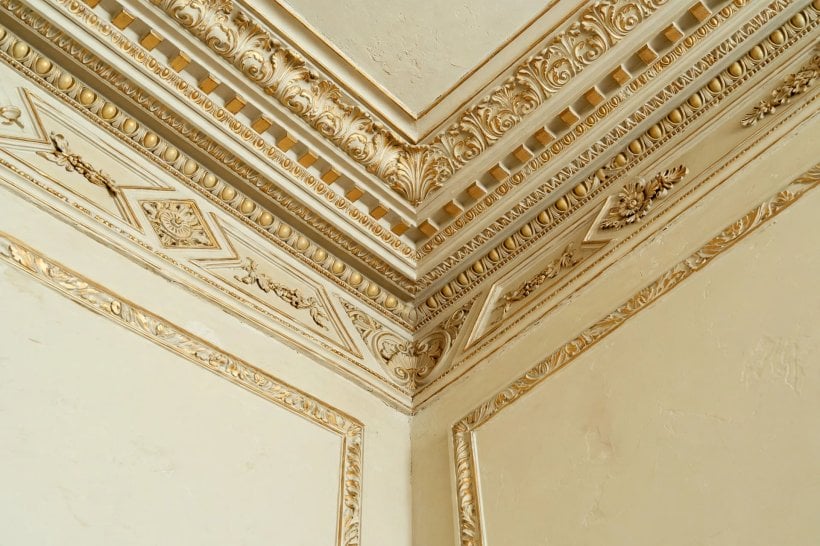 tray ceiling: warm wood planks fitted inside the raised recess