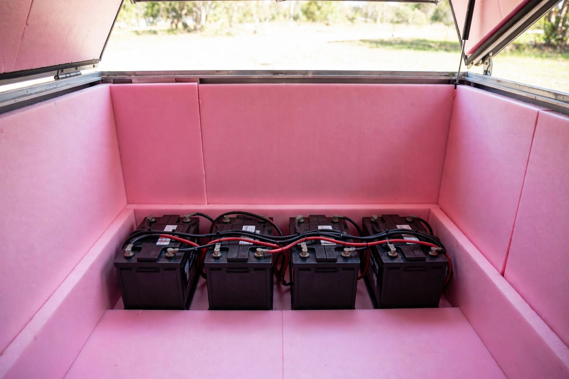 DIY tongue boxes: a battery bank lined with rigid foam insulation inside the compartment