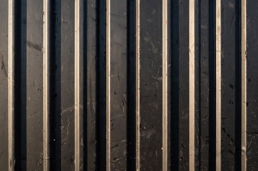 metal siding oil canning: striated panel texture that breaks up reflections