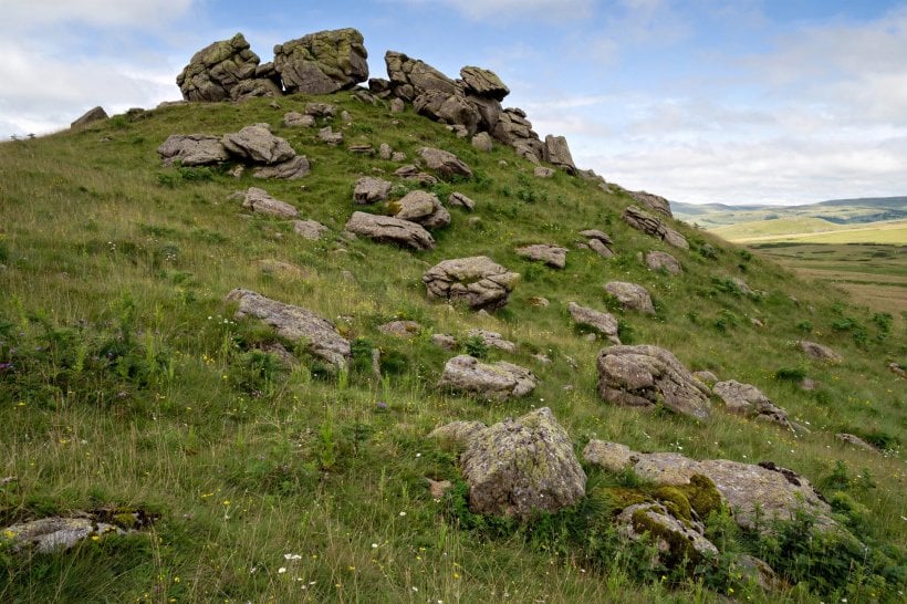Laying Out Big Landscape Rocks: boulders crowning a hilltop and tumbling down a grassy slope