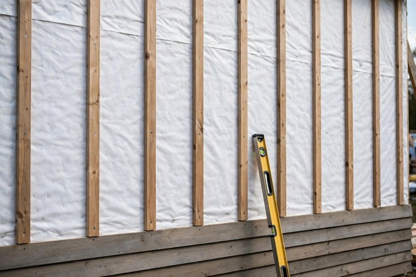 rain screen installation: vertical furring strips aligned over wall studs beneath horizontal lap siding