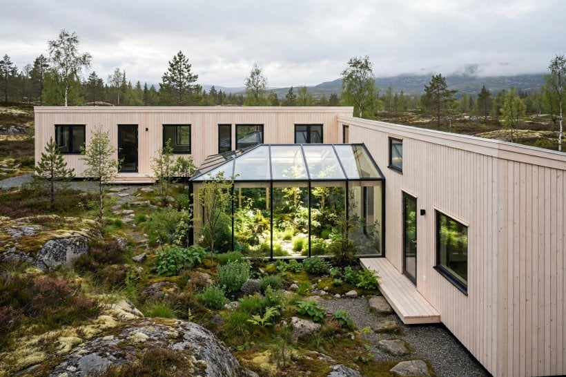 Scandinavian tiny house floor plans: L-shaped courtyard home with a glass-roofed atrium
