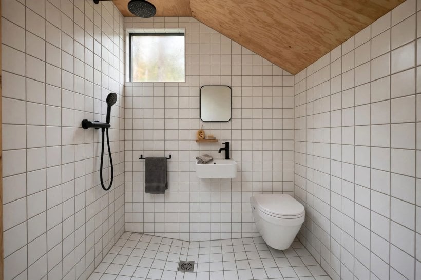 single-story tiny house plans: a wet bath where the whole room is the shower