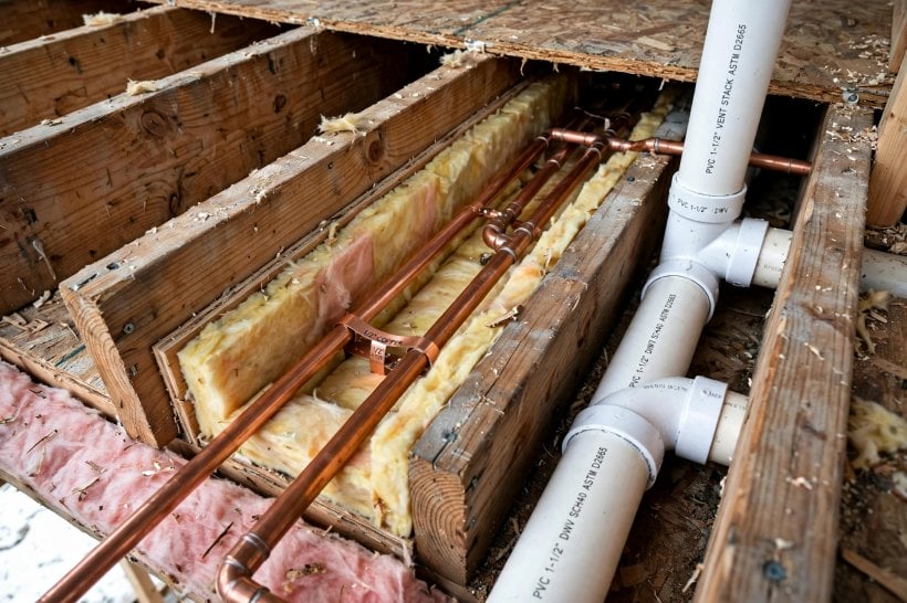 Tiny House Bathroom Layouts: drain and vent plumbing roughed in beneath the bathroom floor