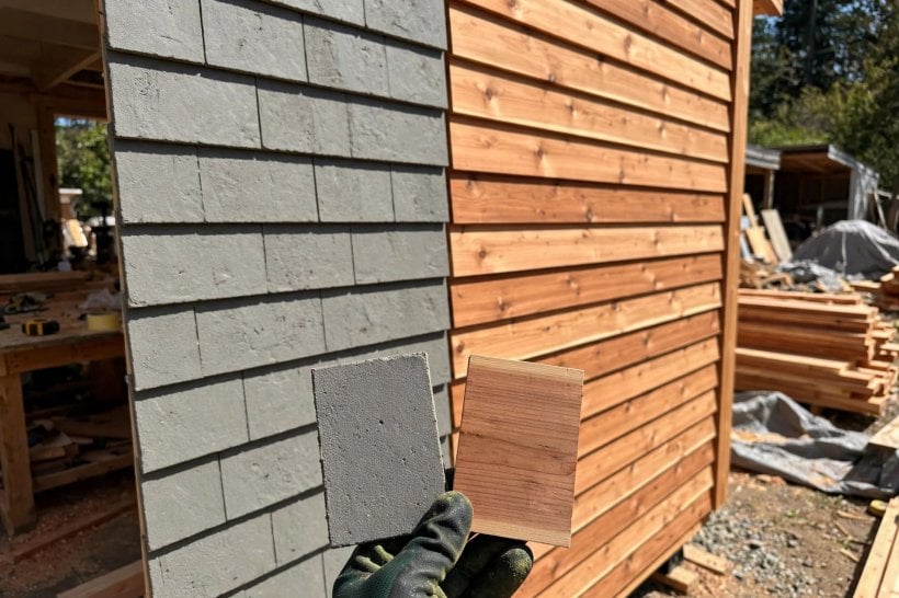 Tiny House Siding Options: fiber cement plank and cedar sample boards compared in hand