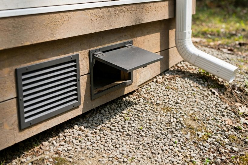 Tiny House Skirting Options: a louvered closable vent in a skirting panel with drainage graded away