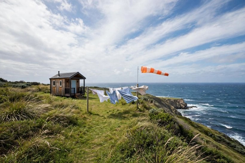 where should I live based on weather quiz: coastal tiny house in a fresh breeze under racing clouds