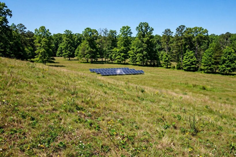 Where to Buy Land for Eco-Living: a south-facing slope with solar array and woodlot
