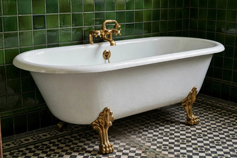 victorian bathroom: compact layout with a roll-top bath and pedestal basin